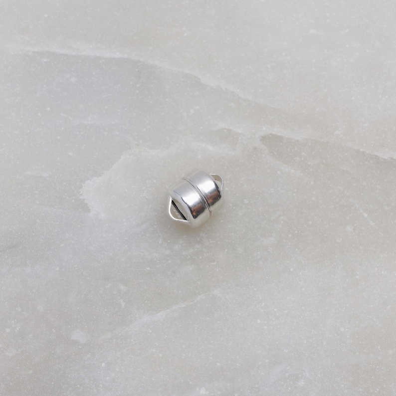 May include: Silver magnetic clasp for jewellery making. The clasp is made of two pieces that connect with a magnetic force.