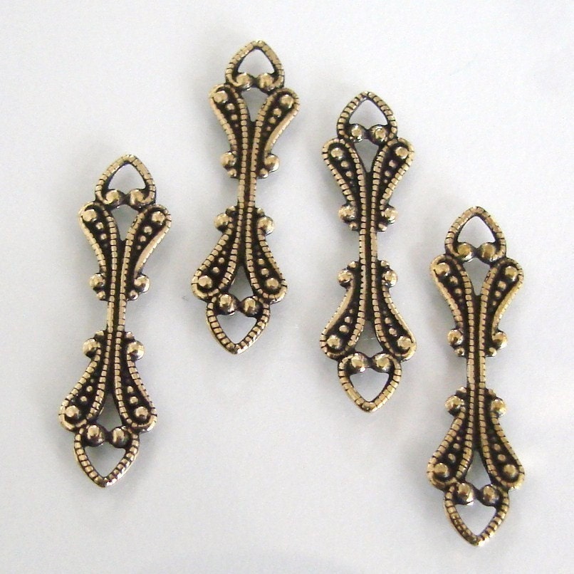 6 Antique Gold Brass Leaf Fold Over Bails 7x35mm AG18 Made in USA 6 Antique Gold Brass Leaf Fold Over Bails 7x35mm AG18 Made in USA