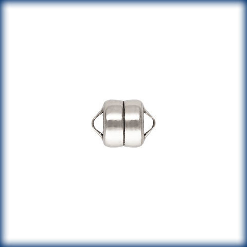 May include: Silver magnetic clasp for jewellery making. The clasp is made of two round pieces that connect magnetically.