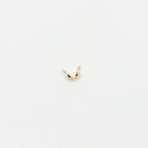 May include: Gold-toned metal clasp for jewelry making. The clasp is open and ready to be attached to a necklace or bracelet.
