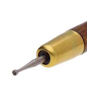 May include: Close-up of a wood-handled burnishing tool with a brass ferrule and a steel tip. The tool is designed for smoothing and shaping materials. The tip is approximately 0.12 inches in diameter.