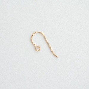 May include: A gold-colored twisted wire earring hook.