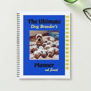May include: A blue spiral bound planner and journal with the text "The Ultimate Dog Breeder's Planner and Journal" in black and yellow text. The cover features a photo of a group of white puppies.