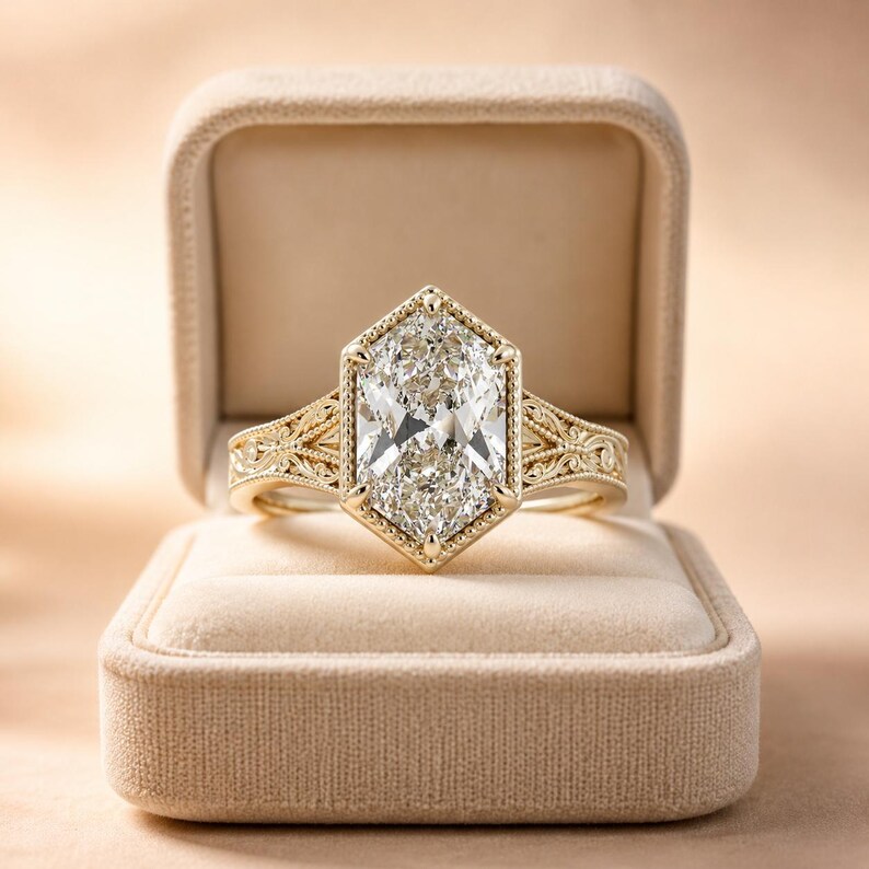 Duchess-cut lab grown diamond engagement ring in 14K yellow gold with vintage milgrain bezel and split shank filigree band, shown in box.