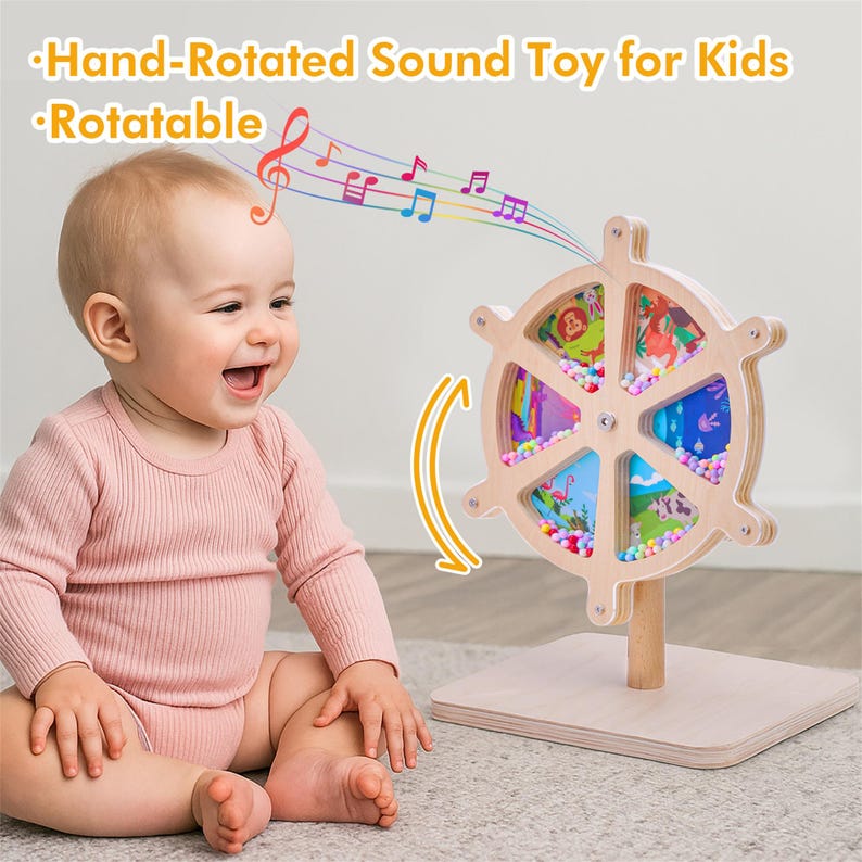 May include: A wooden, hand-rotated sound toy for kids. The toy features a wheel design with colorful panels and small beads. The text "Hand-Rotated Sound Toy for Kids" and "Rotatable" are visible. A baby is smiling next to the toy.