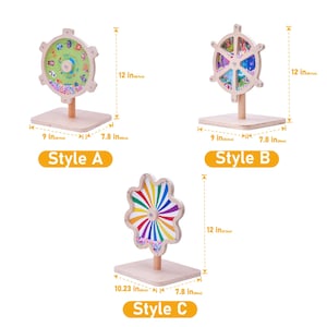 May include: Wooden educational toys in three styles. Style A features a wheel with a green background and animal illustrations. Style B has a wheel with colorful illustrations. Style C has a colorful pinwheel design. Each toy is approximately 12 inches tall.
