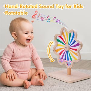 May include: A wooden, hand-rotated sound toy for kids with a colorful, flower-shaped design. The toy features a rotating wheel with rainbow stripes and a base. The text on the image says "Hand-Rotated Sound Toy for Kids" and "Rotatable".