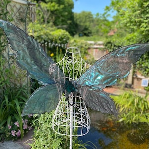 black fairy iridescent wings with a green hue and black stitching