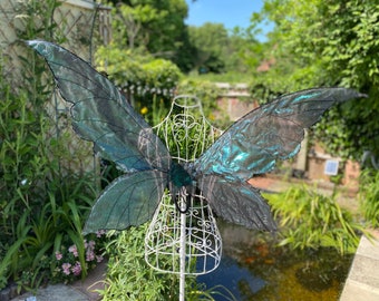 black fairy iridescent wings with a green hue and black stitching