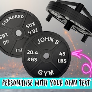 May include: Black weight plates with white lettering. One plate reads "STANDARD" and "20.4 KGS". Another plate says "JOHN'S" and "20.4 KGS". The text "PERSONALISE WITH YOUR OWN TEXT" is at the bottom.
