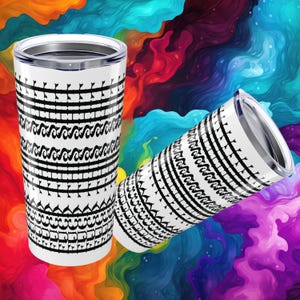May include: Two white travel tumblers with black tribal patterns. The tumblers have a silver rim and lid. The background is a colourful abstract design with swirls of orange, blue, purple, and yellow.