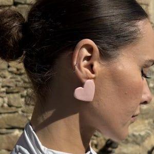 Ceramic earrings, handmade earrings, heart earrings. Available in pink, orange, and blue. Handmade earrings