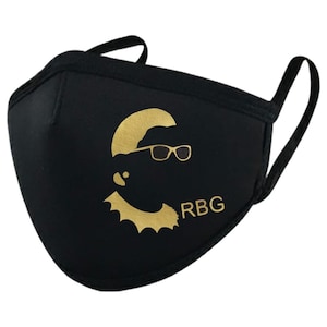 May include: Black face mask with a gold silhouette of Ruth Bader Ginsburg wearing glasses and the text "RBG".