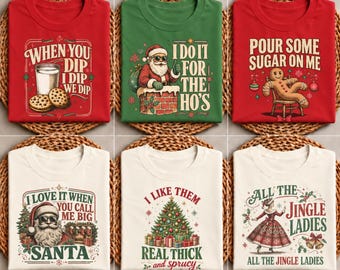 May include: A collection of six t-shirts featuring holiday-themed graphics and text. Designs include Santa, a gingerbread man, and a Christmas tree with phrases like When You Dip I Dip We Dip, I Do It For The Ho's, and All The Jingle Ladies.