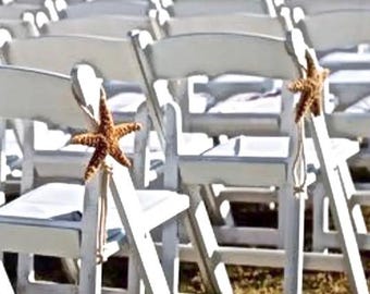 May include: White folding chairs decorated with starfish, a popular choice for beach weddings or outdoor events.