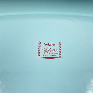 May include: A light blue ceramic bowl with a red Wade Regalo London England logo.