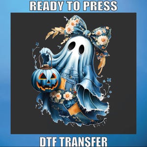 May include: A blue ghost illustration holding a jack-o'-lantern. The ghost has a floral bow and patchwork denim-style clothing. The image includes the text "READY TO PRESS" and "DTF TRANSFER".