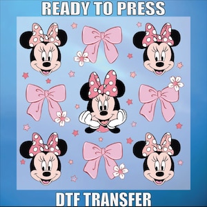 May include: A sheet of clear transfer paper with pink bows and images of Minnie Mouse. The text "READY TO PRESS" and "DTF TRANSFER" is printed on the sheet.