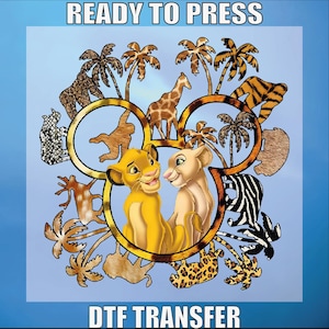 May include: A DTF transfer design featuring a cartoon image of Simba and Nala from The Lion King, surrounded by animal print patterns, palm trees, and other safari animals. The text "READY TO PRESS" and "DTF TRANSFER" are displayed.