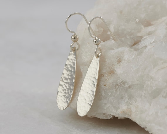 battered silver earrings