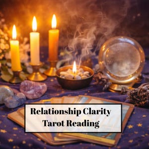 May include: An image featuring a tarot reading setup with lit candles, a crystal ball, and a deck of cards. The text "Relationship Clarity Tarot Reading" is displayed on a rectangular label. The scene is set on a dark blue cloth.