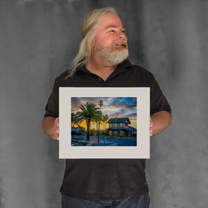 Sun Rises Behind the Depot Building - 7-3/8"x9-7/8" Matted Photo Size