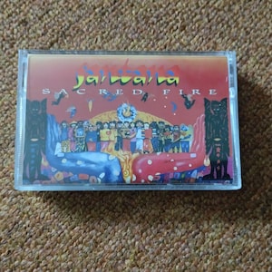 Santana – Sacred Fire (Live In South America) Cassette Tape Latin Pop Rock Jazz Rock Fusion
