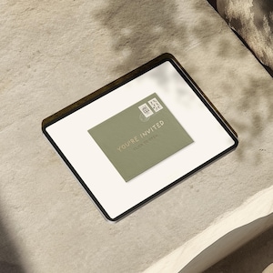 May include: A square, white invitation card with a dark brown border. A sage green envelope is centered on the card, with the words "YOU'RE INVITED" and "CLICK TO OPEN" printed on it. Two postage stamps are in the upper left corner.
