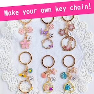 Seasonal cherry blossom or shell keychain with your choice of initial. A handmade, one-of-a-kind gift perfect for any occasion.