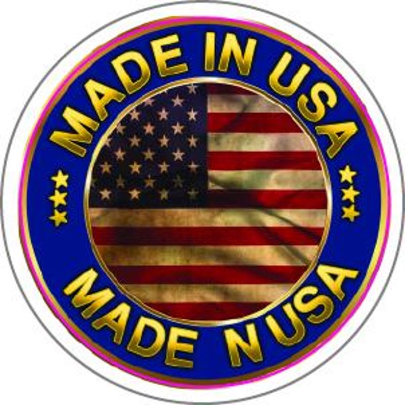May include: Circular sticker with a blue border and gold text that reads "MADE IN USA." The center features the American flag. Three gold stars are on each side of the text.