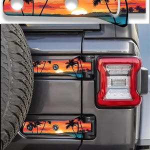 May include: A set of two rectangular hinge covers for a vehicle, featuring a vibrant sunset scene with silhouettes of palm trees against an orange and yellow sky. The covers are installed on the rear door hinges of a dark gray SUV.