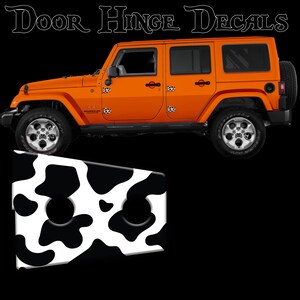 May include: Orange Jeep Wrangler with black and white cow print door hinge decals. The decals are shown on the vehicle and separately. The text "Door Hinge Decals" is at the top of the image.