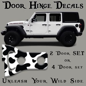 May include: White Jeep Wrangler with black accents and black and white cow print door hinge decals. The image includes the text "Door Hinge Decals", "2 Door Set or 4 Door Set", and "Unleash Your Wild Side".