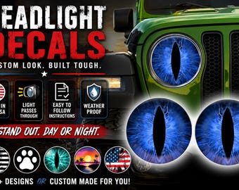 May include: Two circular headlight decals featuring a blue, iris-like eye pattern with a vertical black pupil. The text reads HEADLIGHT DECALS, CUSTOM LOOK. BUILT TOUGH., STAND OUT. DAY OR NIGHT., MADE IN THE USA, LIGHT PASSES THROUGH, EASY TO FOLLOW INSTRUCTIONS, WEATHER PROOF, 100+ DESIGNS OR CUSTOM MADE FOR YOU!.