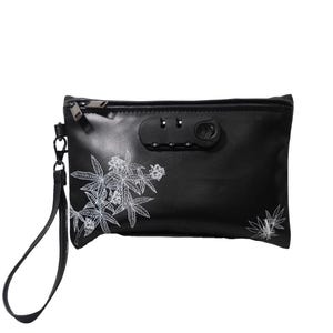 May include: Black leather pouch with a combination lock and a white floral design. The pouch has a strap.