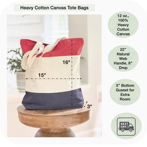 May include: A tri-color heavy cotton canvas tote bag with red, cream, and navy blue sections. The bag has a 22-inch natural web handle with an 8-inch drop. It measures 15 inches wide, 16 inches high, and has a 3-inch bottom gusset.