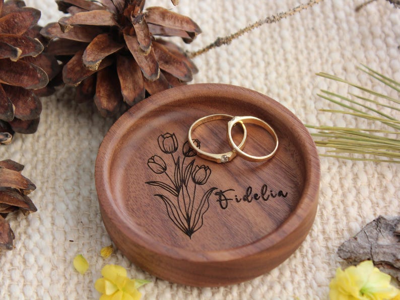 ersonalized Wooden Ring Dish – A Timeless Symbol of Love & Elegance
Mark life’s most precious milestones with a handcrafted wooden ring dish, exquisitely designed to hold your most cherished jewelry. Whether celebrating an engagement, wedding, anniversary, birthday, or a special gift for a loved one, this piece is more than just a ring holder—it’s a keepsake of treasured memories.