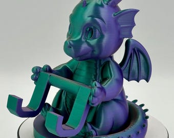 Soporte para teléfono con forma de dragón impreso en 3D: un accesorio de escritorio original y divertido.