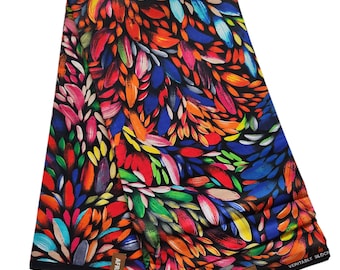May include: A colourful fabric with a pattern of abstract brushstrokes in shades of red, orange, yellow, green, blue, and pink on a black background. The fabric is folded in half and the edges are trimmed with black.