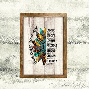 May include: A framed print with a colorful sunflower design and the text "God says you are" surrounded by words like "unique", "special", "lovely", "precious", "strong", "chosen", and "forgiven" with corresponding bible verses.