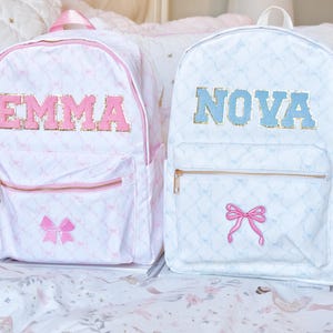 May include: A set of three ceramic mugs with a speckled, matte finish in cream, light grey, and dark grey. Each mug has a simple, minimalist design, ideal for coffee or tea.