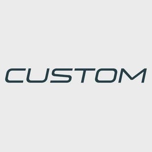 May include: The word CUSTOM is written in a dark blue, sans-serif, stylized font against a light gray background. The letters are spaced out, featuring rounded corners and a modern, geometric design that is centered in the frame.