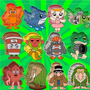 May include: A collection of colorful cookie cutters in various cartoon character shapes, including a shark, monkey, penguin, and frog. The cutters are made of plastic and are set against a bright green background.
