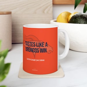 Tastes Like A Denver Broncos Win | 11oz - 15oz Ceramic Mug | Lucky Football Victory Game Day Gift For Dad, Club Sports Fan Cup