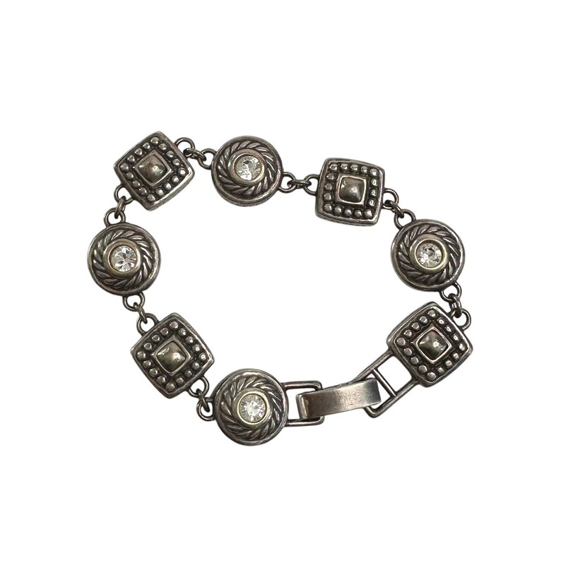 K&ouml;nnte beinhalten: Silberfarbenes Armband mit abwechselnd quadratischen und kreisf&ouml;rmigen Gliedern. Jedes Glied ist mit einem zentralen, klaren Kristall und dekorativen Details verziert. Das Armband hat einen Verschluss.