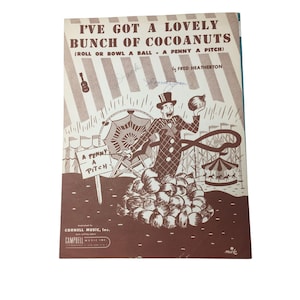 May include: Vintage sheet music titled "I've Got a Lovely Bunch of Cocoanuts" by Fred Heatherton. The cover features a cartoon illustration of a man in a checkered suit, a top hat, and a pile of coconuts, with carnival imagery in the background.