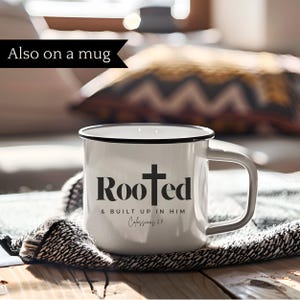 May include: White enamel mug with a black rim and handle. The mug has a black cross and the text "Rooted & built up in him Colossians 2:7" printed on it.
