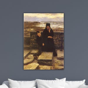 May include: A framed print of a somber painting depicting a woman and a young boy near a stone wall. The woman, dressed in black, stands near a tombstone. The boy kneels beside it. The background shows a seascape under a cloudy sky.