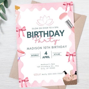 May include: Pink birthday party invitation with a spa theme. The invitation features a lotus flower, makeup brushes, and a basket of spa products. The text on the invitation reads "Glow on over to a spa birthday party" and includes the date, time, and location of the party.