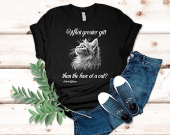 May include: Black t-shirt with a white graphic of a cat looking up and the text "What greater gift than the love of a cat?"  The text is attributed to "Eleanor  Caldwell"